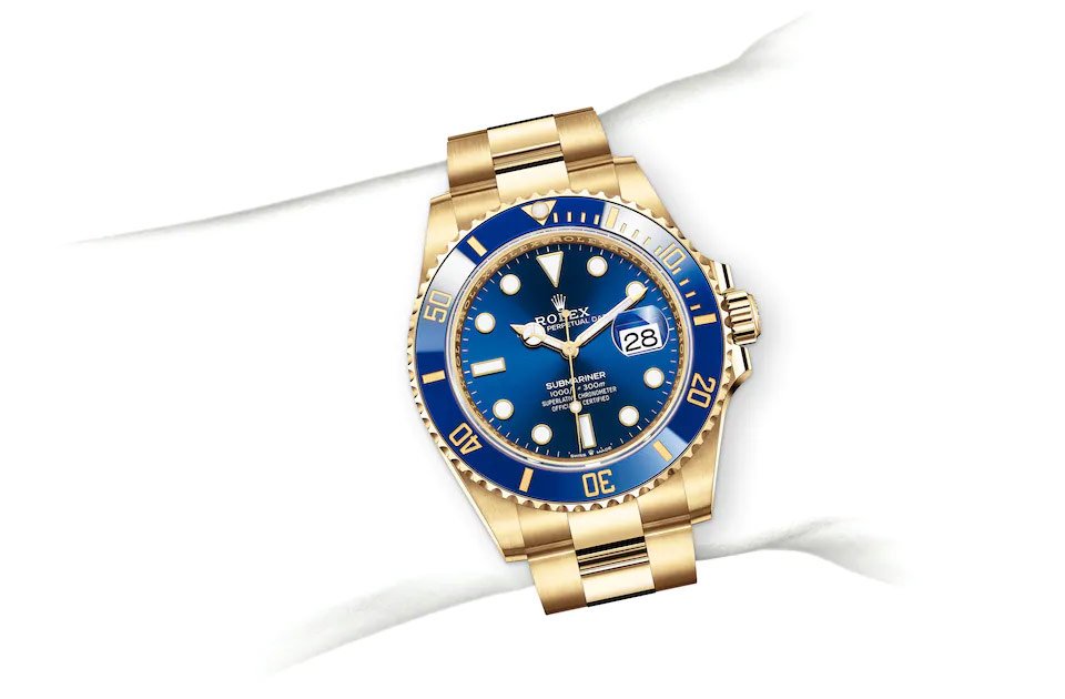 Rolex Submarine yellow gold and a blue dial date  comInline Delivery Info